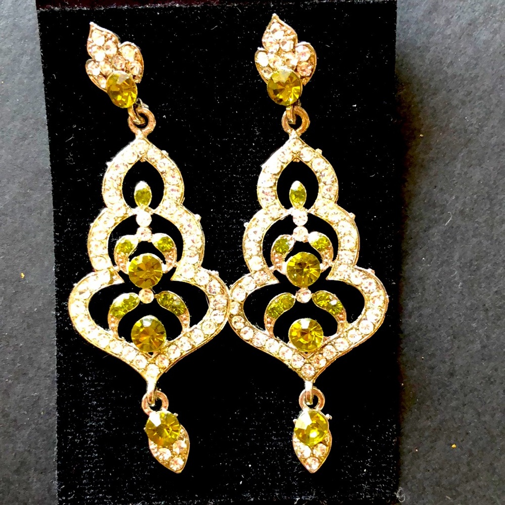 Sterling silver diamond earrings with the green diamond